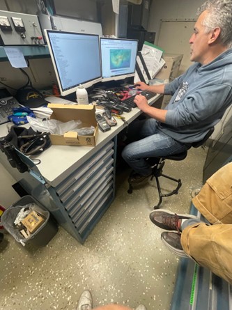 A tech works on a computer