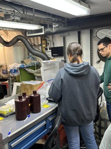 Maliana with sample bottles