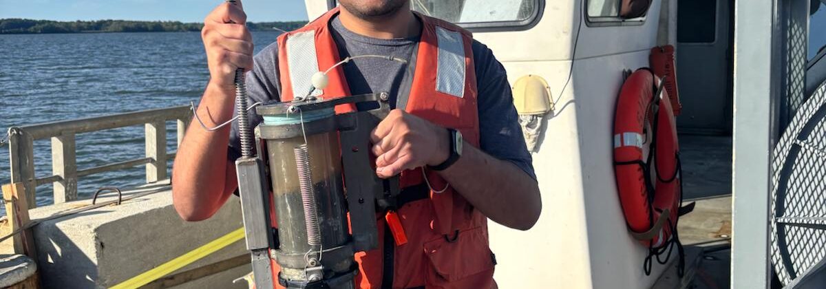 Amaar holding a sediment core