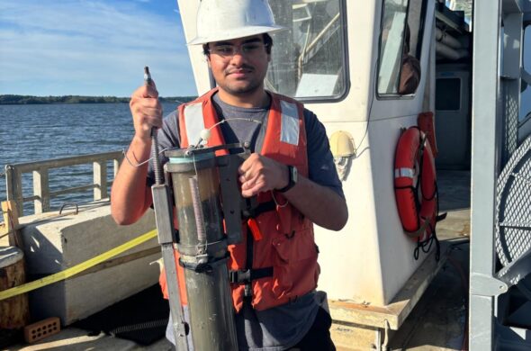 Amaar holding a sediment core