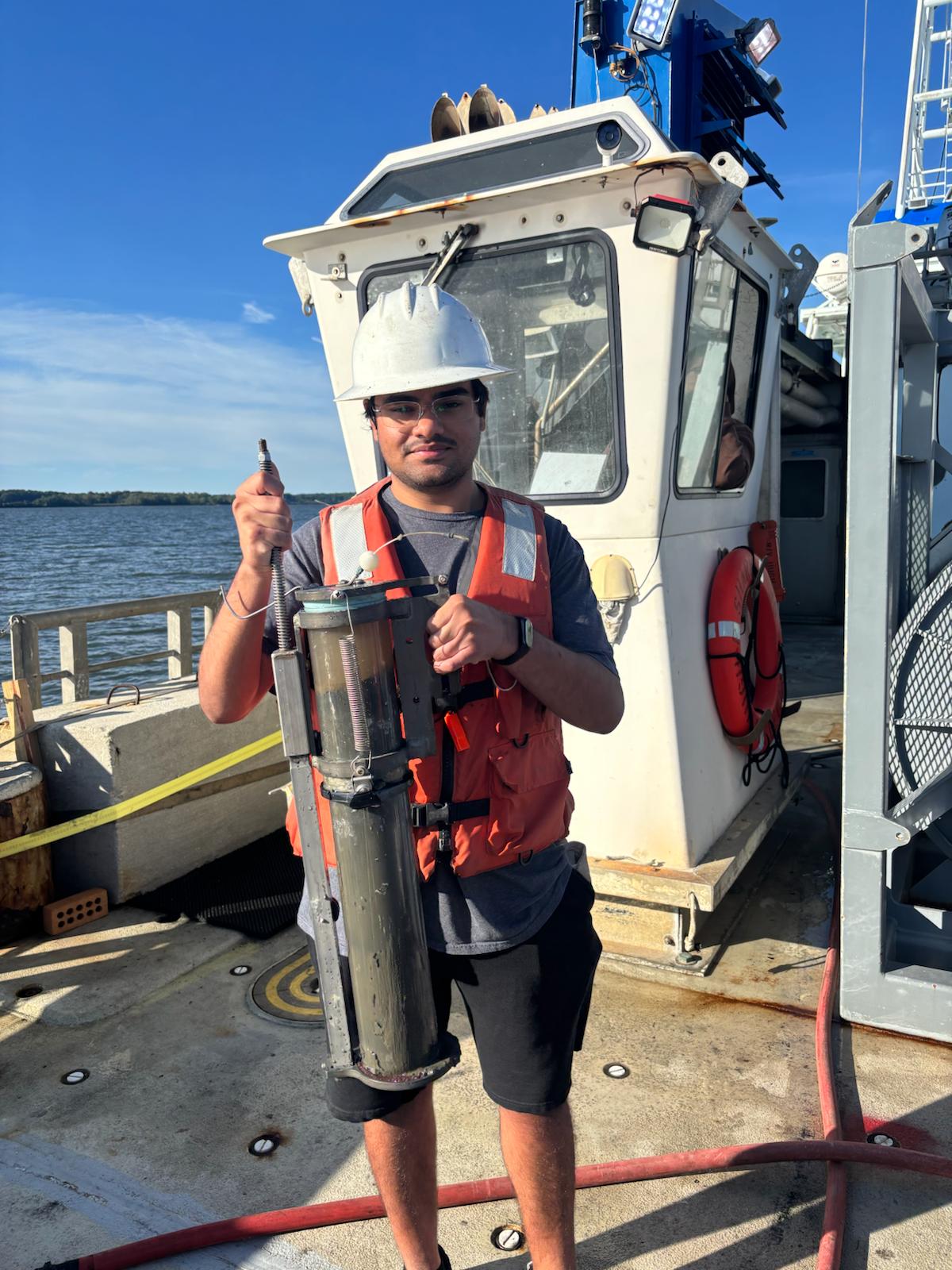 Amaar holding a sediment core