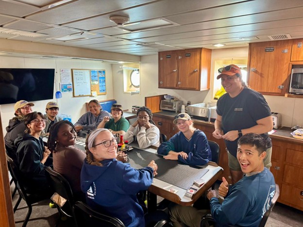 sitting around a table playing cards