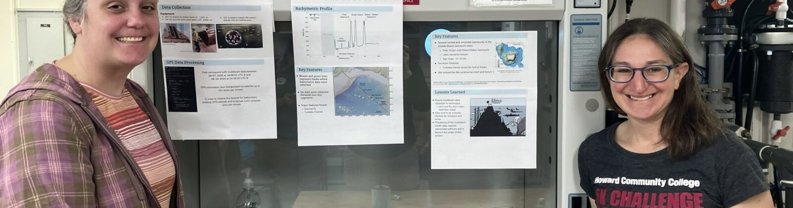 Jordan and Beth posing by their presentation poster