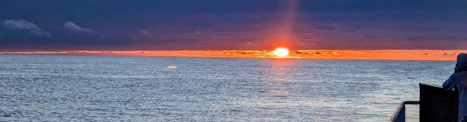 sunset on the starboard side of the boat