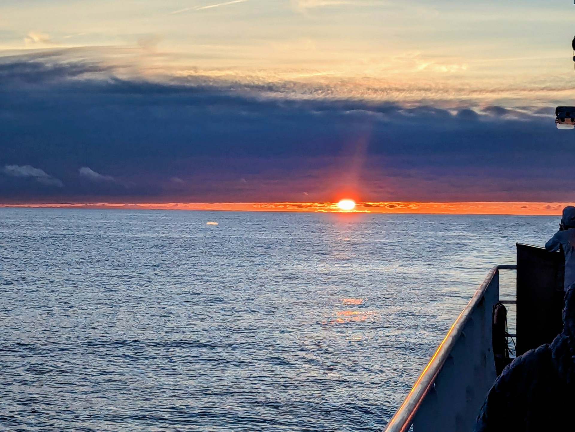 sunset on the starboard side of the boat